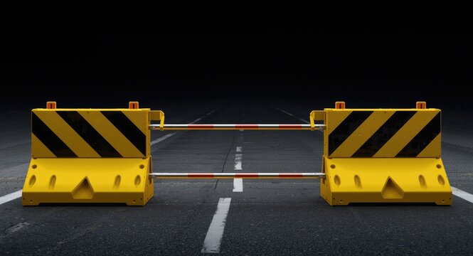 Bold black and yellow safety barricades placed on vacant road for traffic and construction control