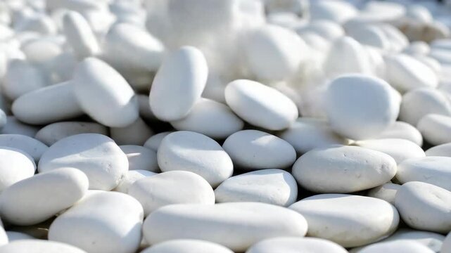 Close up of smooth white decorative pebbles for landscape garden or zen spa design