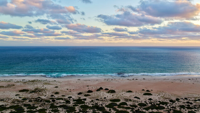 Great Australian Bight - Scenic Lookout, Nullarbor Plain, South Australia &ndash; 4K aerial drone view of dramatic coastal cliffs, turquoise ocean and rugged wilderness at sunset