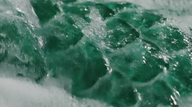 Intricate Emerald Dragon Scales Pattern Interacting with Effervescent Water and Bubbles