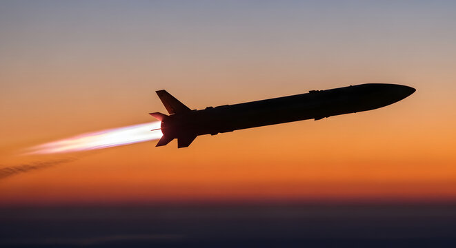 Silhouette of a Missile Launching Against a Vibrant Sunset Sky