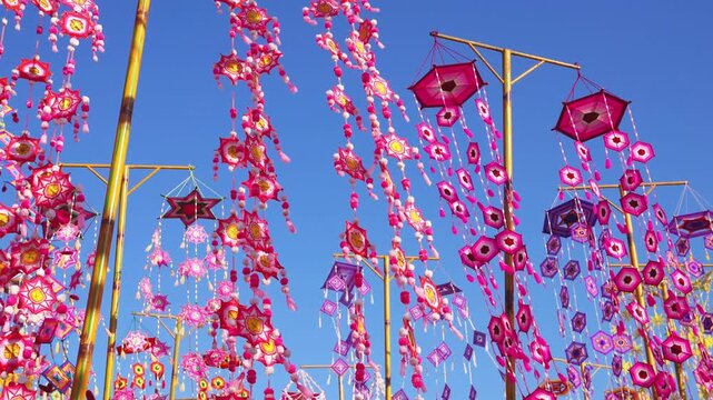 The sea of ​​Isaan tung(flags), brightly colored tung swaying with the wind.