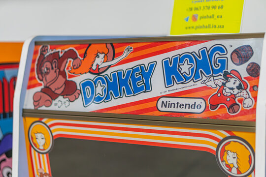 Orange-yellow Donkey Kong arcade machine with Nintendo logo - Kyiv, Ukraine - June 7, 2025