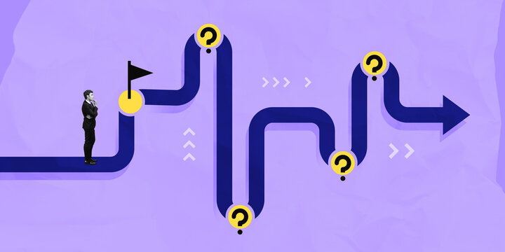 Businessman facing winding path with question marks and goal fla