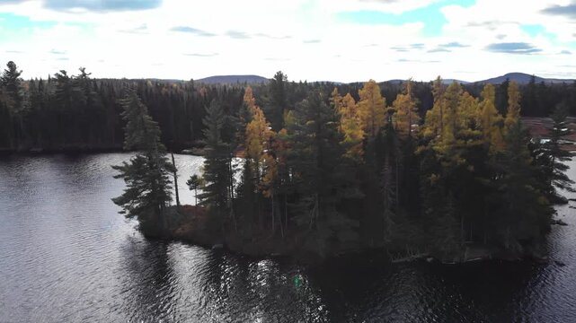 Aerial Drone Orbit Around Autumn Trees on Lake Island, Mont-M&eacute;gantic, Quebec