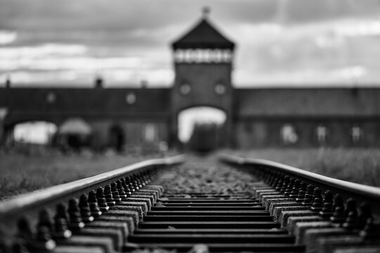 Low angle railway tracks at the Auschwitz Birkenau memorial gate