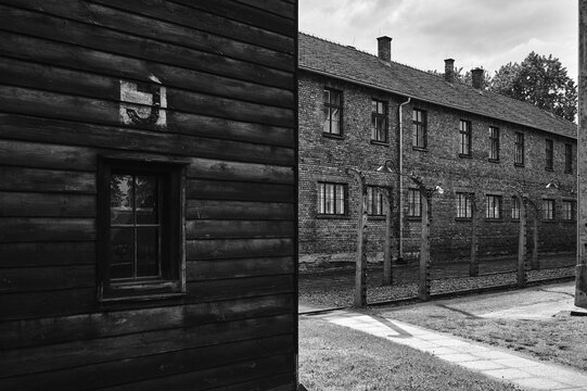 Brick barracks behind wooden building at Auschwitz camp