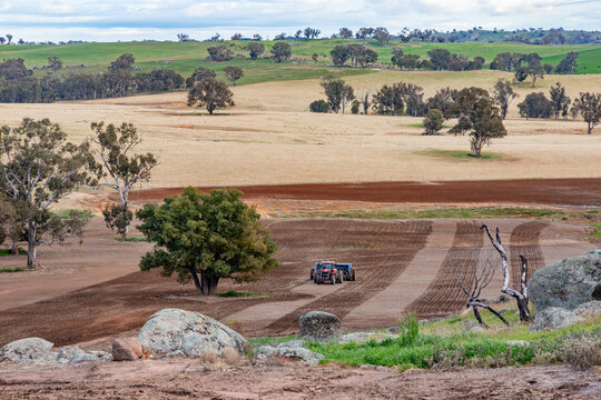 tractor and combine planter seeding wheat and pasture on a farm