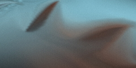 Obraz premium A Blurry Image of a Shark or Fish Swimming in the Ocean Water
