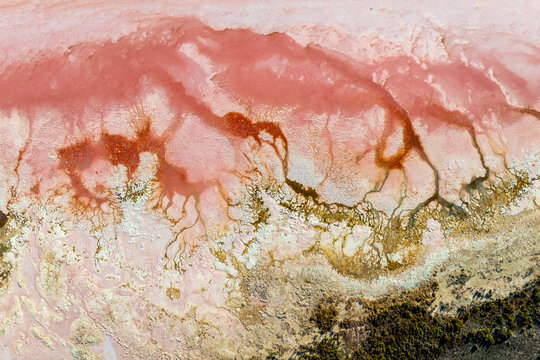 Aerial series of abstract pink salt crusts and mineral textures at Hutt Lagoon