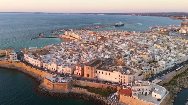 Aerial sunset view of Gallipoli Old Town in Salento in Puglia Italy