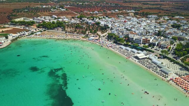 Aerial view of Sant Isidoro beach and shallow turquoise bay