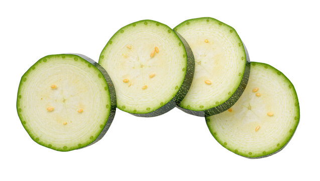 Isolated fresh green zucchini slices, healthy organic vegetable cut into perfect rounds