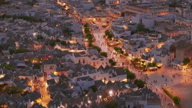 Aerial night view of the illuminated Trulli in Alberobello, Puglia, Italy