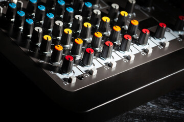 Fototapeta premium recording mixer knobs on black background