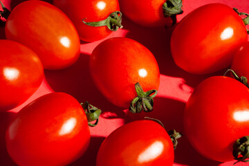 cherry tomato on red background