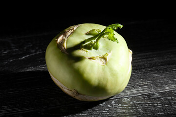 kohlrabi on black wood background
