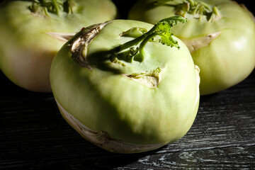 kohlrabi on black wood background