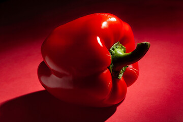 red bell pepper on red background