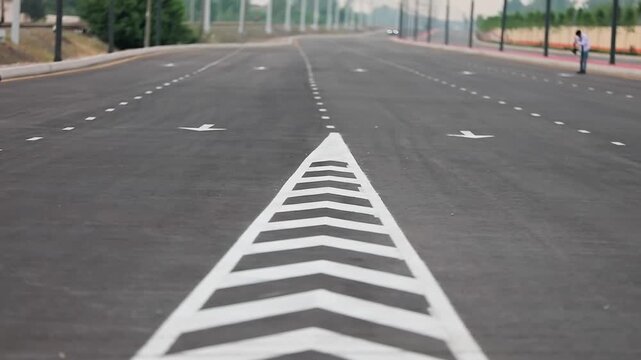 Close-up of road markings on urban asphalt highway