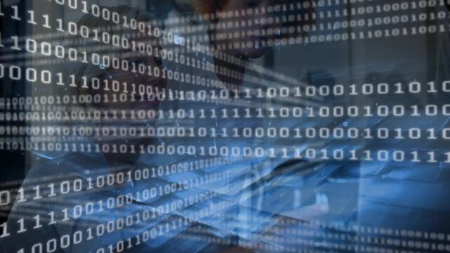 Two women typing at laptop, input shifting binary overlay while collaborating on data security