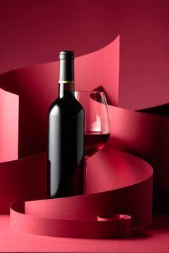 Bottle and glass of red wine.