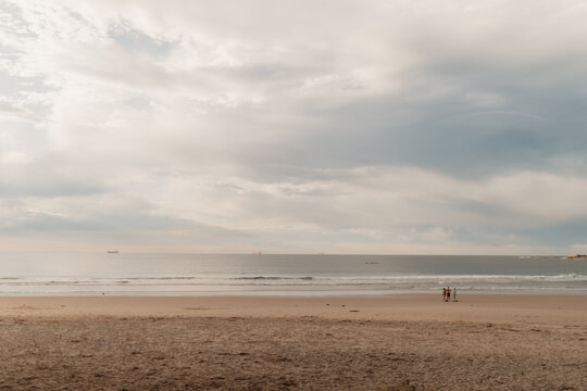 Tranquil morning at the beach with group of people in the distance