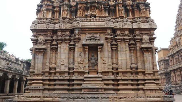 Detailed view of Brihadeeswarar Temple architecture in Thanjavur, Tamil Nadu. Intricate stone carvings and sculptures on historic Chola dynasty Hindu temple facade in India