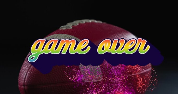 Animation of game over and abstract pattern over rugby ball against black background