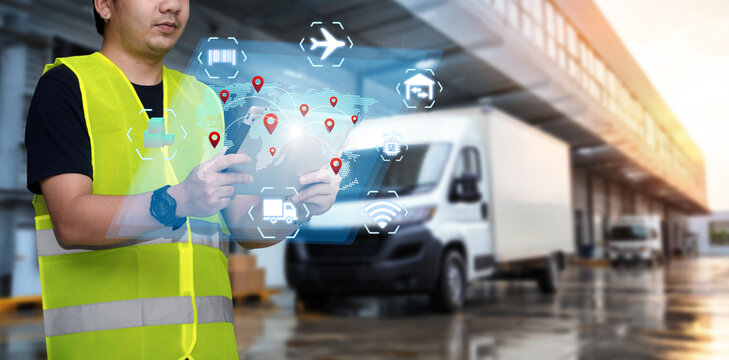 Smart Inventory logistics management system concept.Manager using digital tablet,showing warehouse software management dashboard on blurred warehouse as background