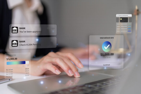 Woman using laptop completes a secure international wire transfer through a virtual banking interface showing approved notifications fintech digital payment money transfer