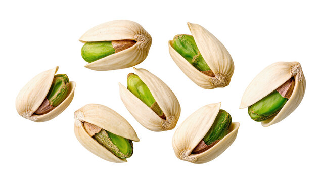 Isolated group of seven delicious green pistachios with open shells, healthy snack food.