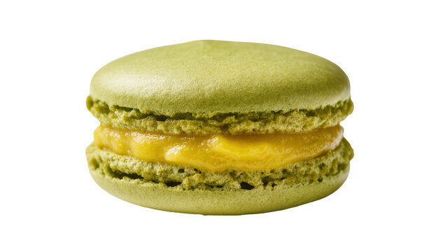 Isolated delicious sweet single green pistachio macaron with creamy yellow lemon filling