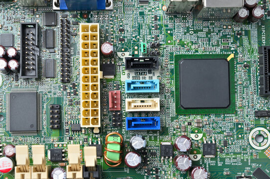 Close-up view of a complex computer motherboard with various electronic components and connectors