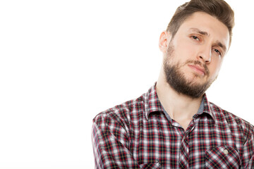Fototapeta premium Close up portrait of handsome smiling young man with beard wearing plaid shirt looking at camera isolated on white background