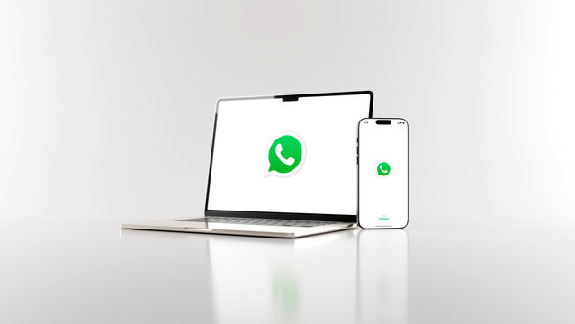 WhatsApp messaging app on smartphone and laptop in white background, digital communication concept. Rendering in 8k high resolution.