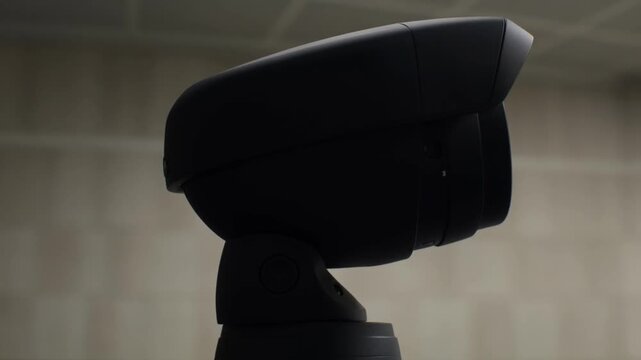 Modern webcam black camera office technology video conference indoor lighting minimalist design plastic device privacy concept communication gadget studio equipment technology surveillance security