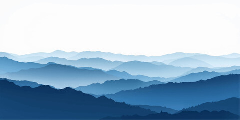 Misty mountain landscape featuring snowy peaks and a forest valley under a blue sunrise sky with clouds and fog at dawn. © ATIA