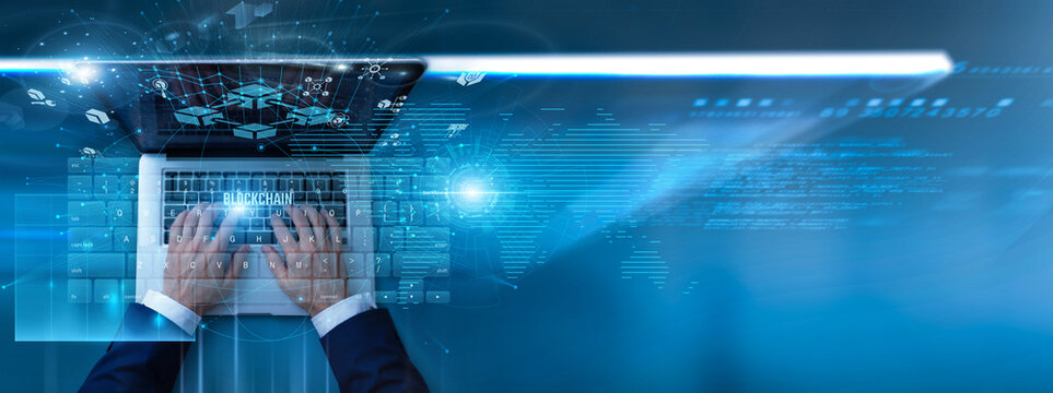 Developer using laptop with blockchain decentralized network on keyboard and analysis digital ledger transactions, cryptocurrency systems, secure verification protocols, and financial technology.