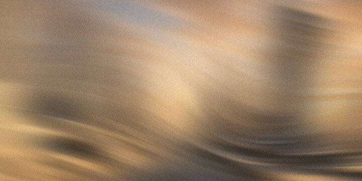 Abstract background featuring soft flowing waves of golden light and dark textured shadow layers