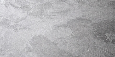 A grunge winter background featuring a rough gray stone texture with old paint and a dirty ice pattern of snow on the road and ground © Md