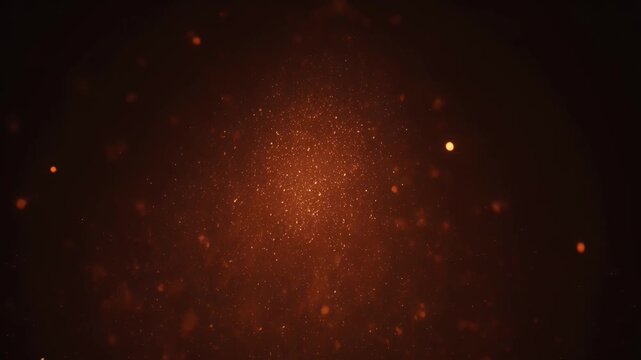 Dark background with glowing orange and red particles, concentrated centrally, fading out