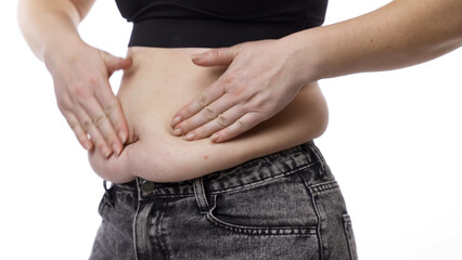 Female with excess weight displaying body change. Sports, weight loss, and healthy lifestyle concept.