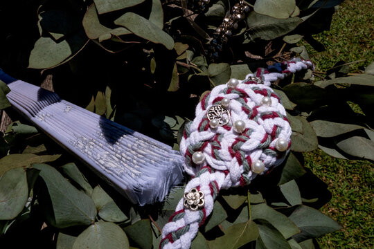 Traditional Wedding Handfasting Cord with Pearls on Green Leaves