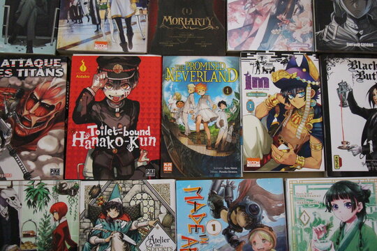 helf filled with colorful manga books from various series