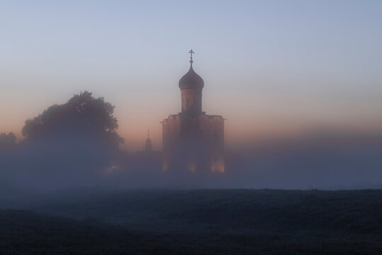 The medieval Church of the Intercession on the Nerl in a foggy September dawn. Bogolyubovo, Vladimir region. Russia