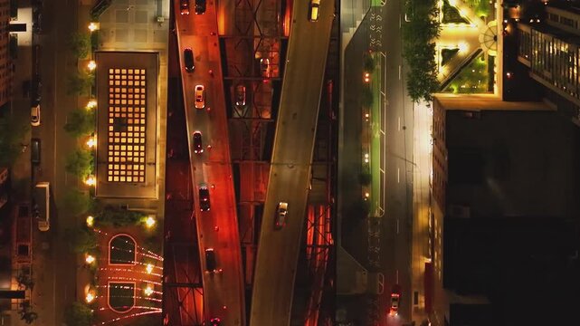 City streets at night with cars driving on roads and urban lights