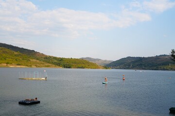 Travel romania transilvania targu mures people paddleboarding and relaxing on a lake