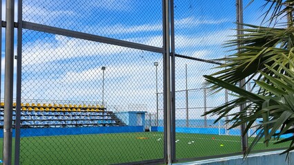 A large football stadium with open stands © Elena