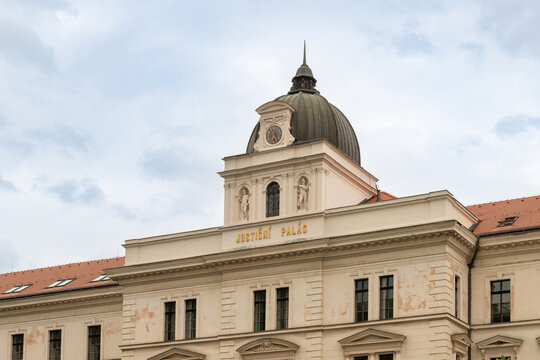 Decorated upper part of Regional Court building in Prague on Kinsky Square in Prague old city in Czech Republic